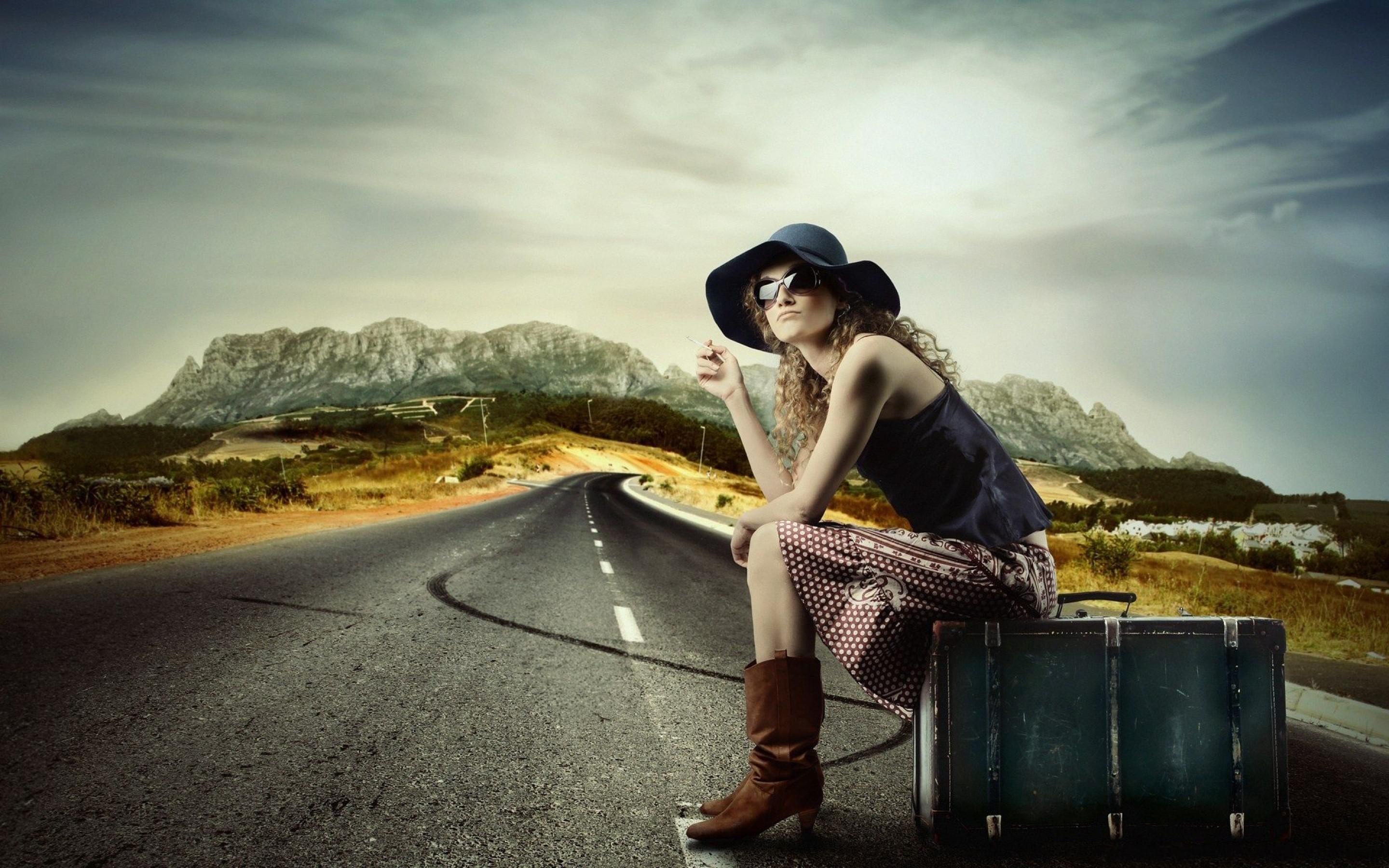 Girl on the road hitchhiking